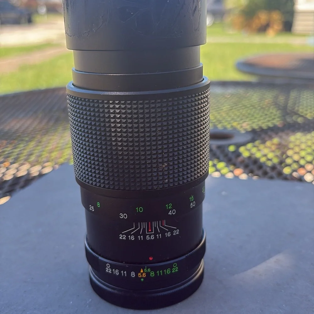 The image shows a Vivitar 300mm 1:5.6 lens. Additional information: